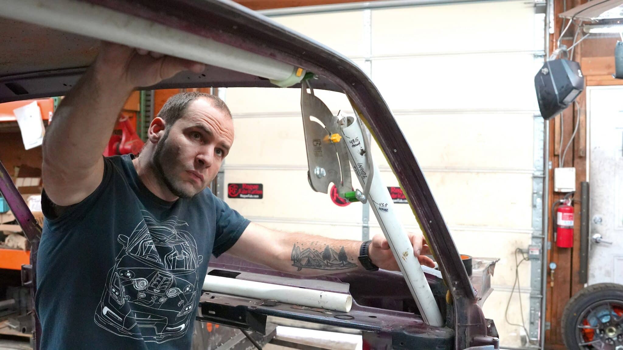 Joe Gambino fitting a tube inside the 1972 BMW 2002 shell at the Rogue Fabrication shop in Sandy, Oregon