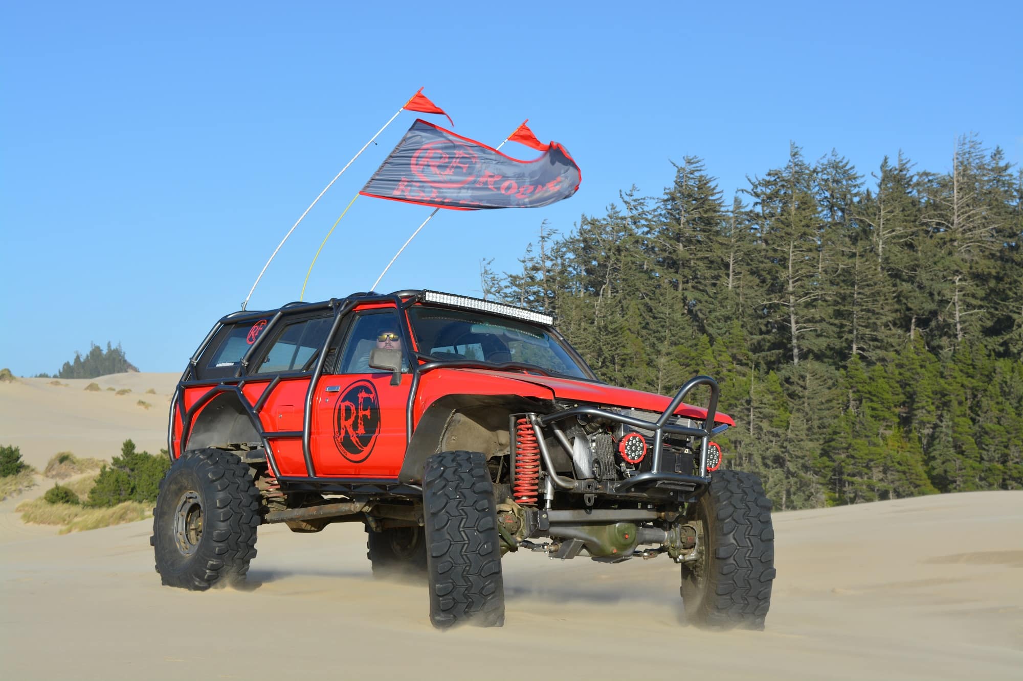 Joe Gambino's 1988 Toyota 4Runner Project Turbo Mogrunner with Rogue Fabrication exo cage and 42-inch Super Swamper tires navigating the Oregon Dunes