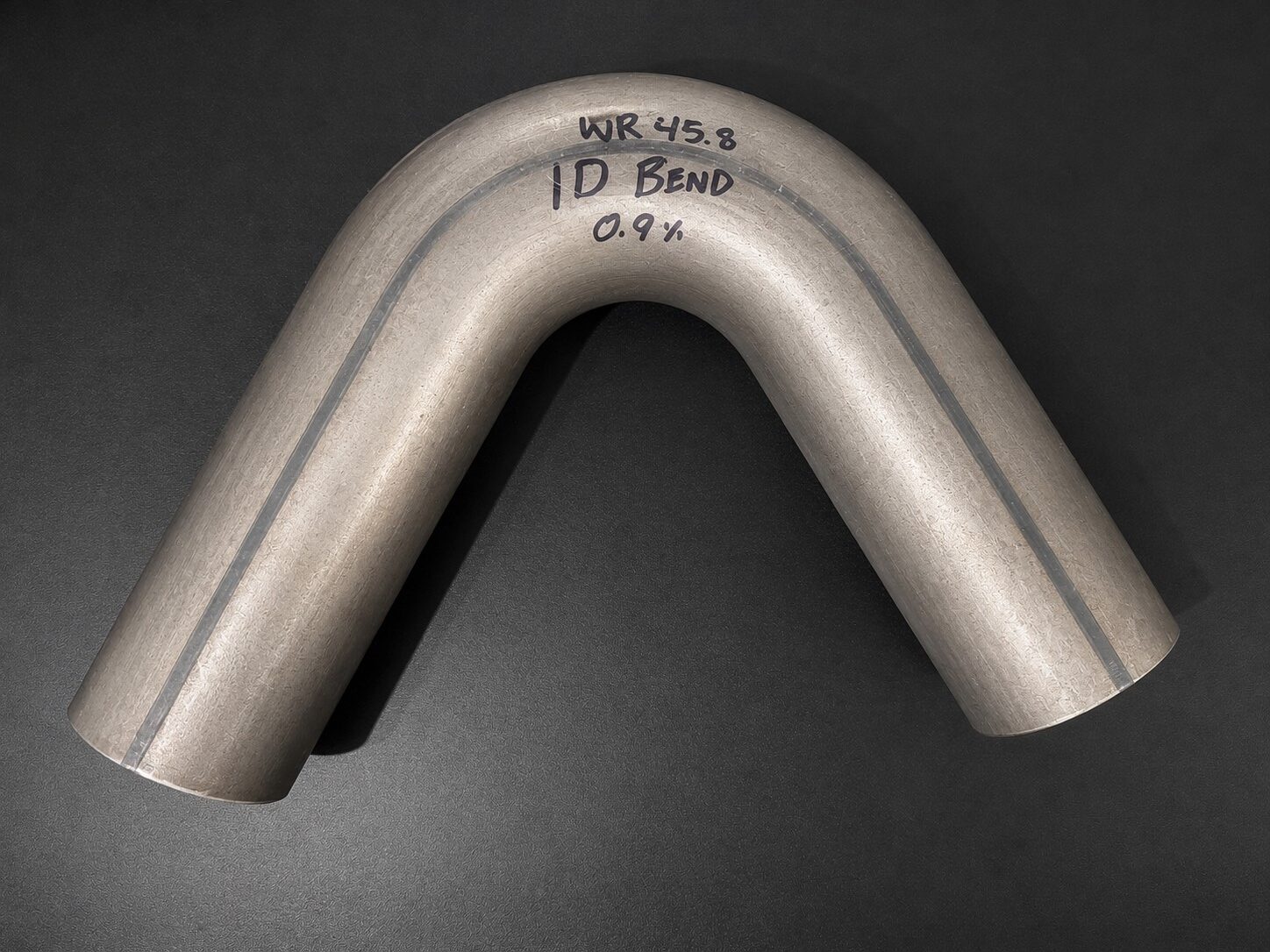 2.75 inch exhaust pipe bend showing cross section deformation from ram bending