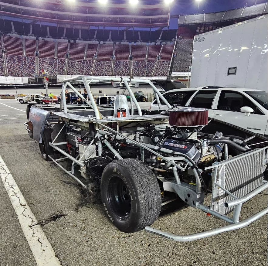 Circle track race car full tube chassis showing complete roll cage structure