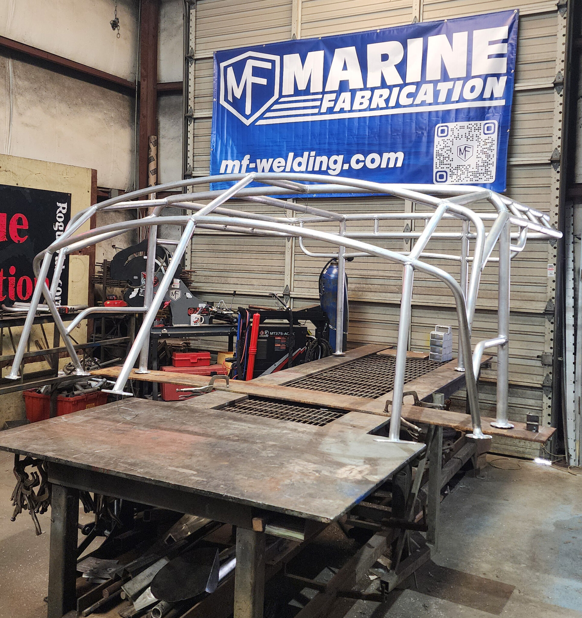 Custom aluminum T-top frame for center console boat built by MF Welding using RogueFab tube bender